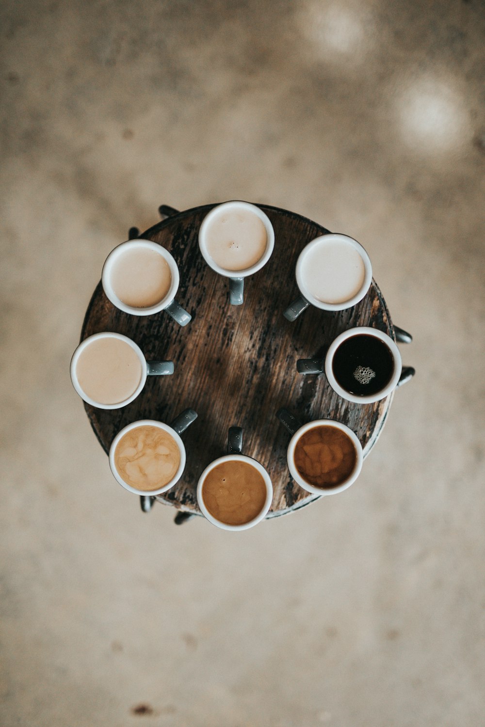 Barista pouring latte art into a ceramic cup