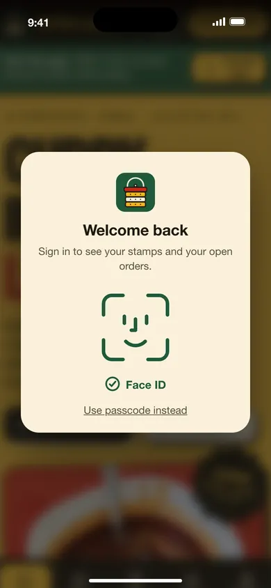 Phone showing a Face ID sign-in card for the Tiffin Lane app