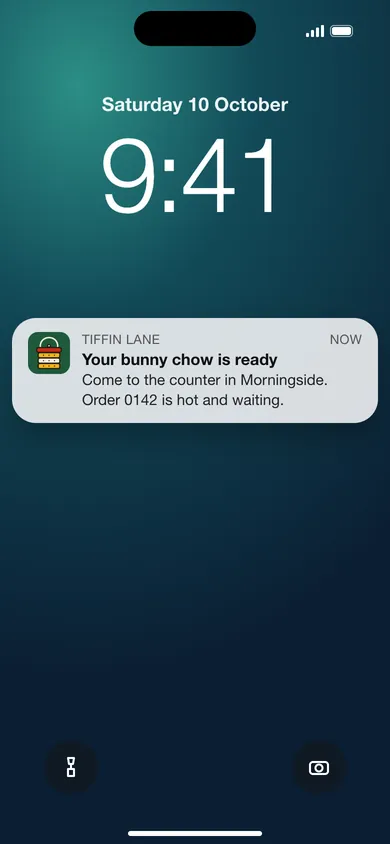 Phone lock screen showing a Tiffin Lane notification that the order is ready